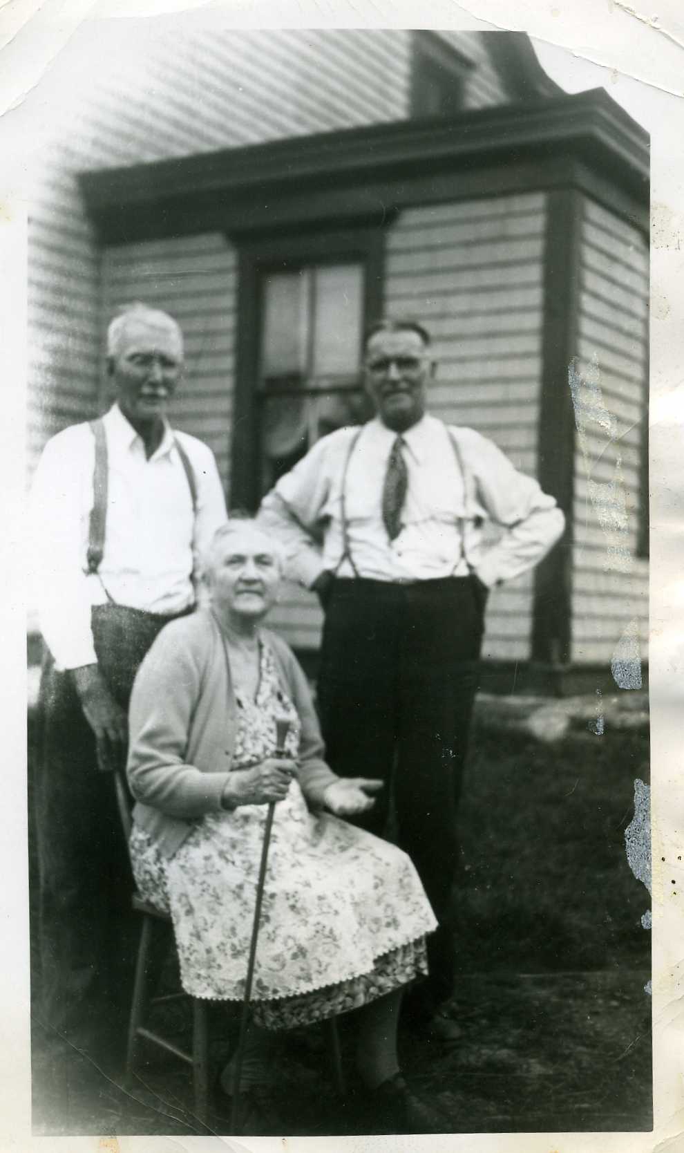 My grandfather Charles Leslie Crittenden is standing on the right side.  I don't know who the other two people are in the picture.